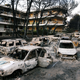 Burned cars are seen following a wildfire in the village of Mati, near Athens.